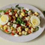 Boiled eggs are bursting with nutrition, but may not always be welcomed by kids! Try out this Indian style egg salad that's also loaded with veggies!