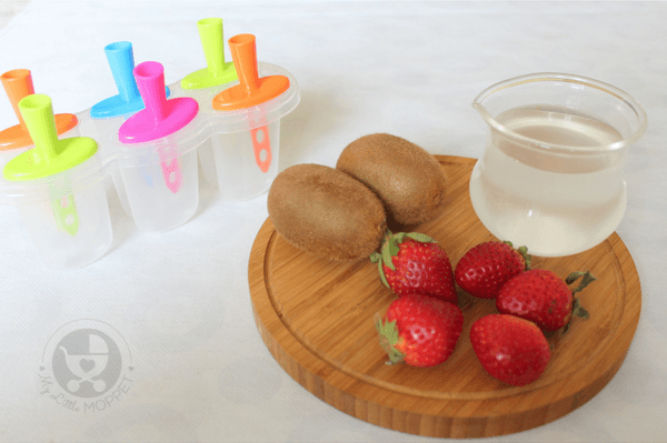 Ingredients for fruit popsicle-kiwis and strawberries