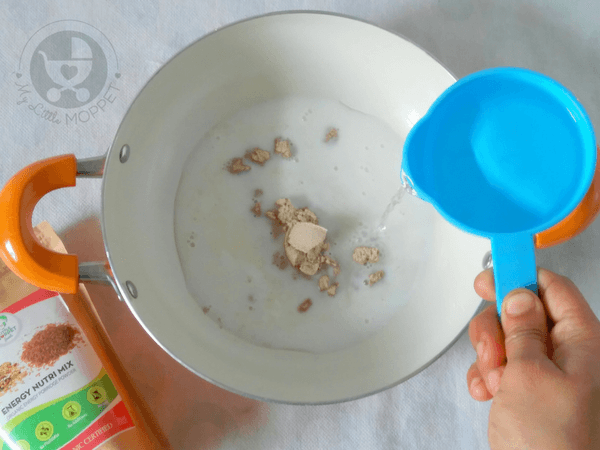 in a saucepan add nutrimix, milk and water