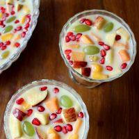 Easy Fruit Custard is a milk based delicious dessert made by mixing fresh seasonal fruits in chilled custard sauce. Easily made but delicious and healthy.