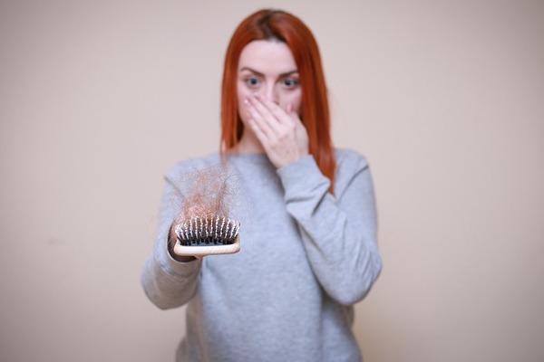 Postpartum hair loss is a normal occurrence, and one that goes away with time. However, you can use these tips to reduce its impact.
